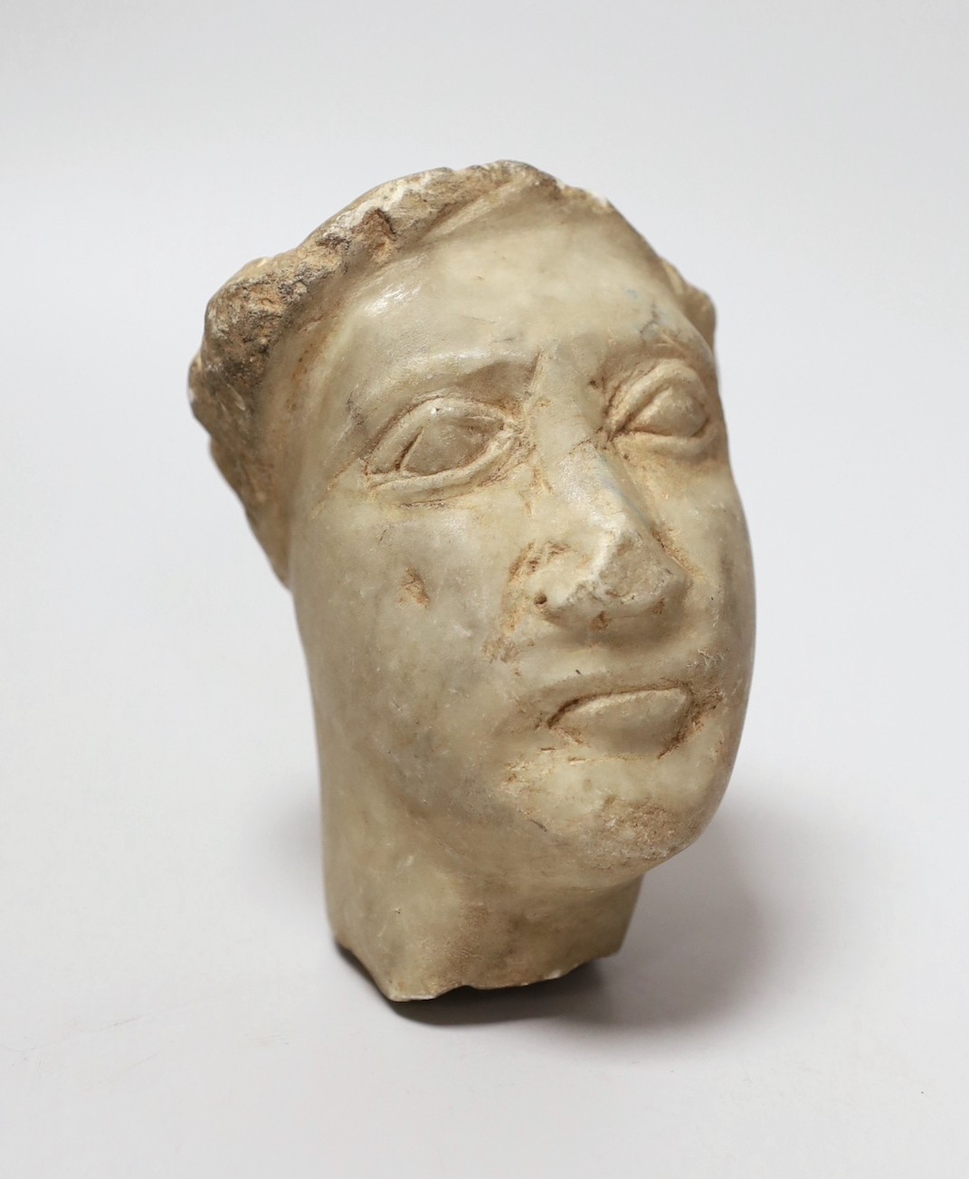 A marble head of a man in Hellenistic style, 12cm long